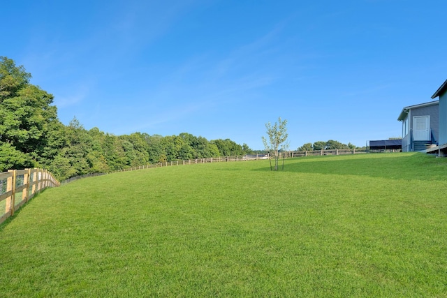 view of yard with a rural view