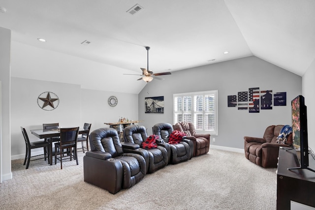 carpeted living room with vaulted ceiling and ceiling fan