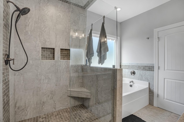 bathroom featuring independent shower and bath, tile walls, and tile patterned floors