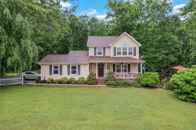 view of front of home with a front lawn and covered porch