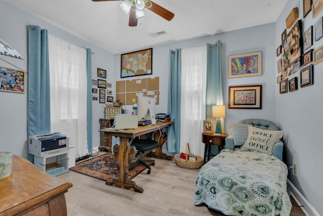 interior space featuring ceiling fan and light wood-type flooring