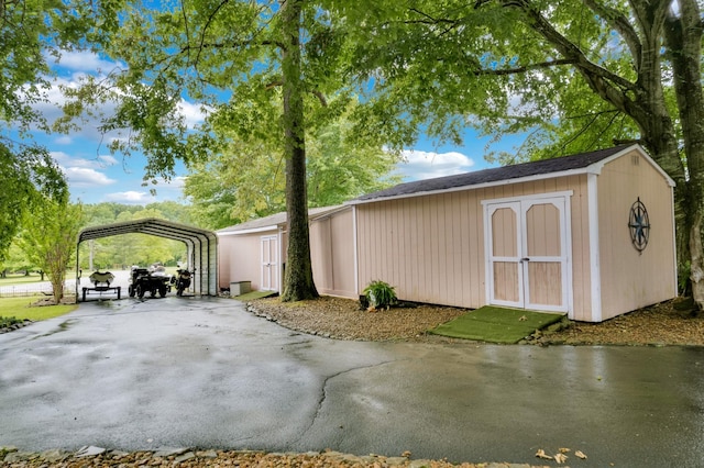 view of outdoor structure with a carport