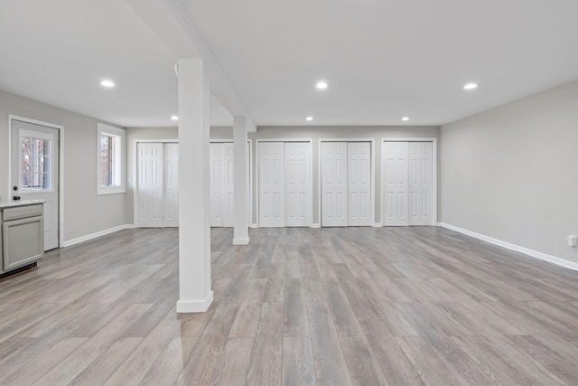 basement featuring light hardwood / wood-style floors