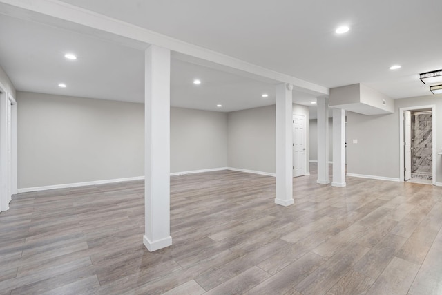 basement featuring light hardwood / wood-style flooring