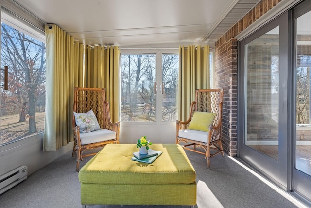 sunroom / solarium featuring a baseboard heating unit