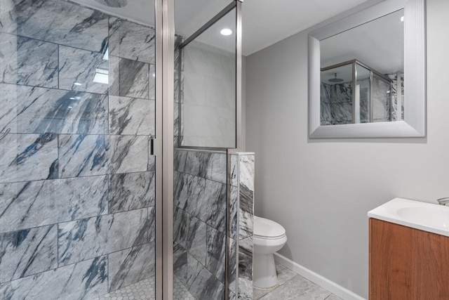 bathroom with vanity, tile patterned flooring, a shower with shower door, and toilet