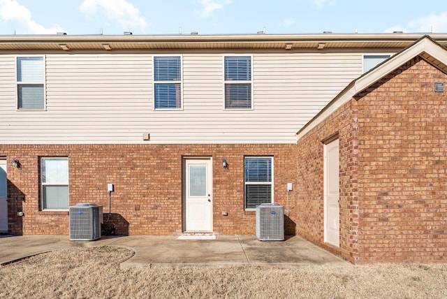 back of house with central AC and a patio area