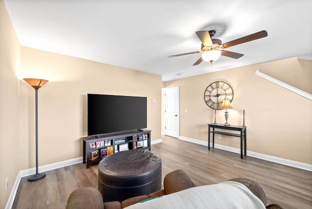 living room with hardwood / wood-style floors and ceiling fan