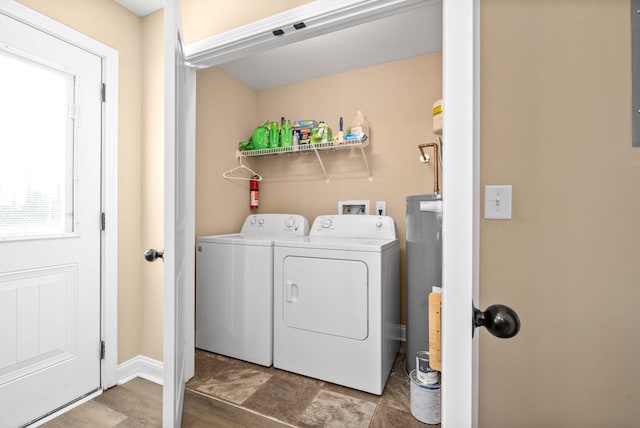 laundry area featuring independent washer and dryer and water heater