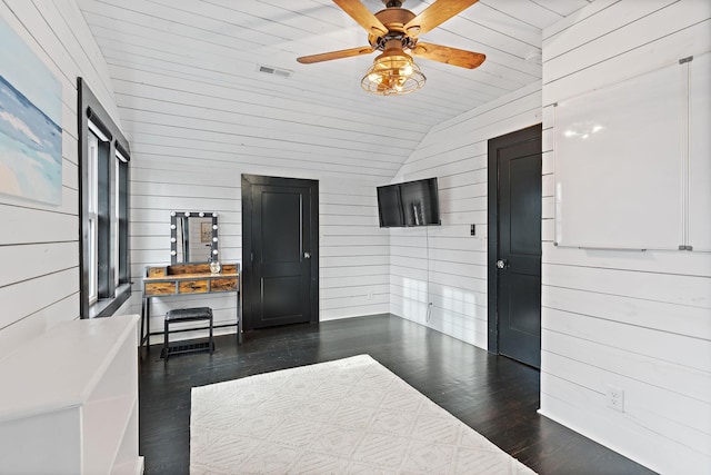 interior space featuring vaulted ceiling and ceiling fan