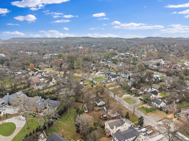 birds eye view of property featuring a mountain view