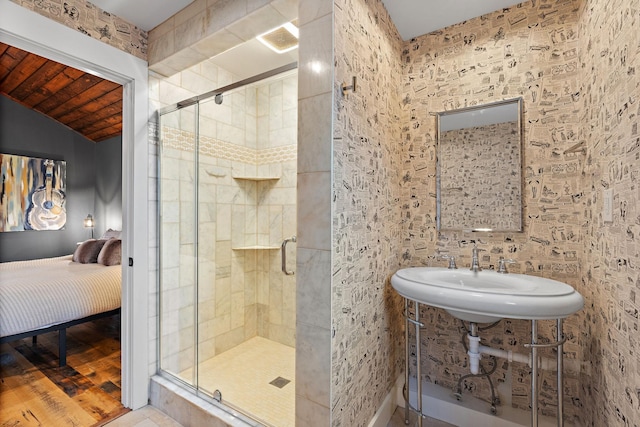 bathroom with sink, an enclosed shower, hardwood / wood-style floors, and wooden ceiling