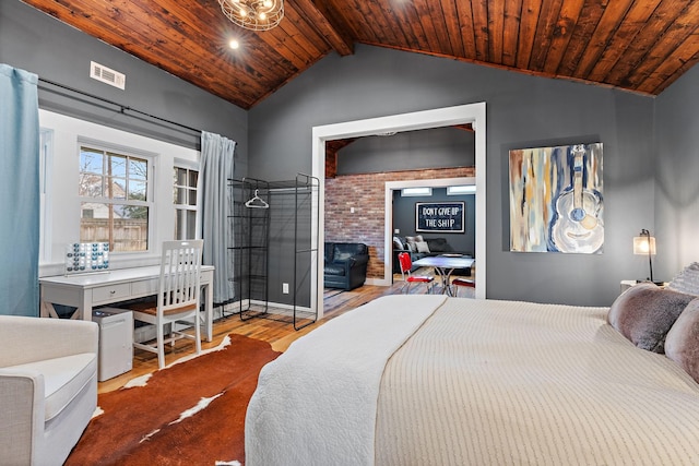 bedroom with wood ceiling, wood-type flooring, and lofted ceiling with beams