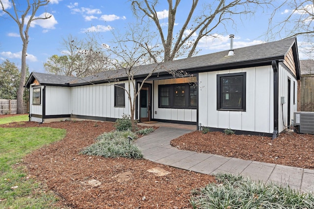 ranch-style house featuring central air condition unit