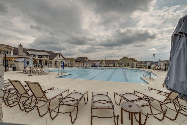 view of pool featuring a patio area