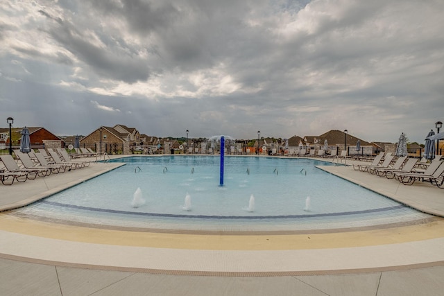 view of swimming pool featuring pool water feature