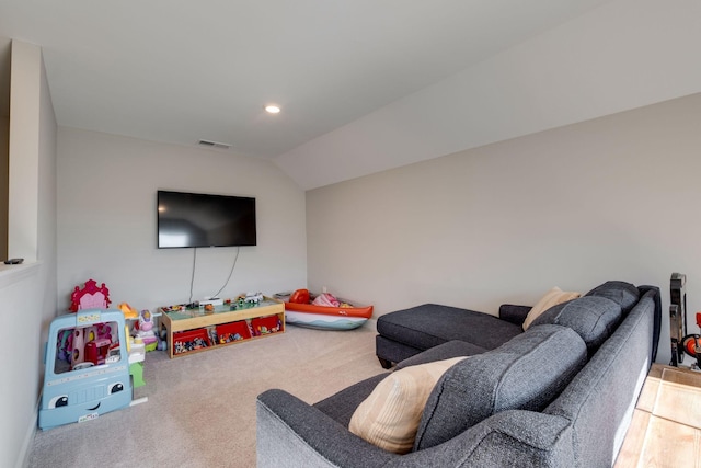 carpeted living room featuring lofted ceiling