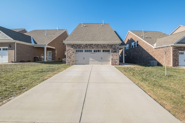 view of front of home featuring a garage, central AC, and a front yard