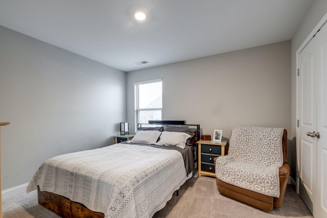 bedroom with a closet and carpet flooring