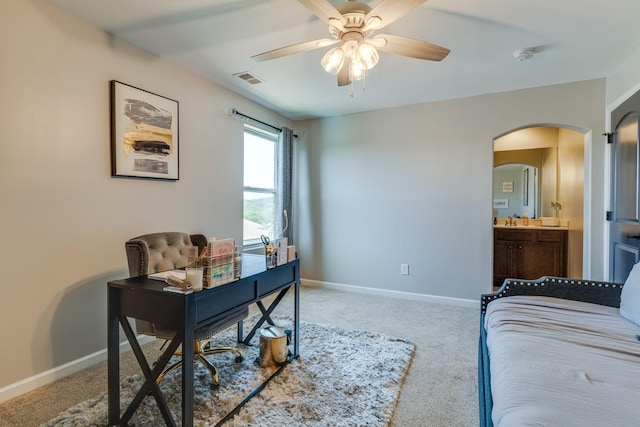 home office with carpet, sink, and ceiling fan