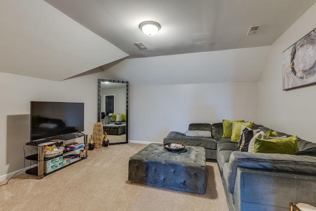 carpeted living room with vaulted ceiling