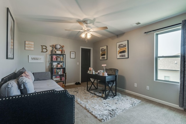 office with light colored carpet and ceiling fan