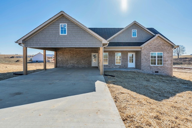 view of front facade with a carport