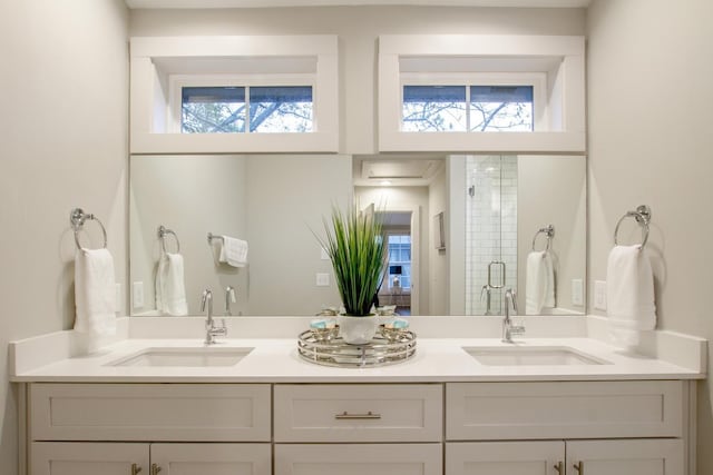 bathroom with vanity and an enclosed shower