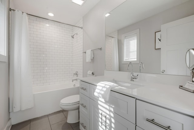 full bathroom featuring tile patterned flooring, vanity, shower / tub combo with curtain, and toilet