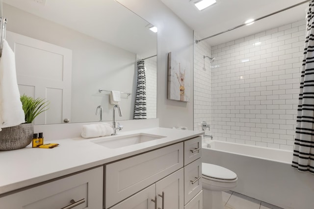 full bathroom with vanity, shower / tub combo, tile patterned floors, and toilet