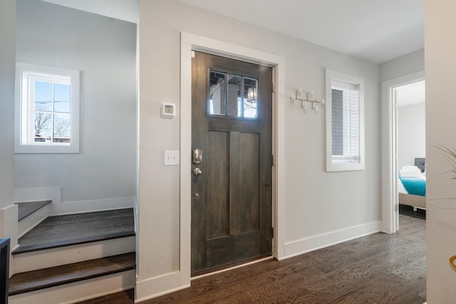 foyer entrance featuring dark hardwood / wood-style floors