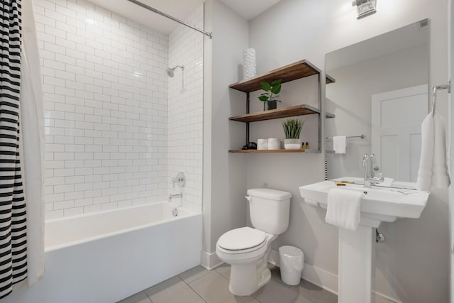 bathroom with tile patterned flooring, toilet, and shower / bath combo