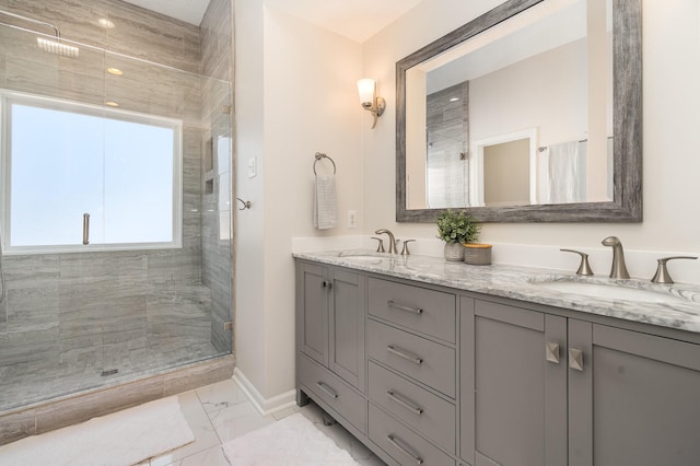 bathroom with vanity and tiled shower