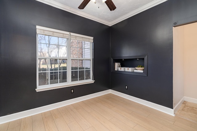 unfurnished room with crown molding, wood-type flooring, and ceiling fan