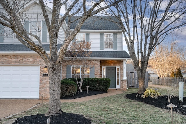 view of front facade featuring a garage and a front yard