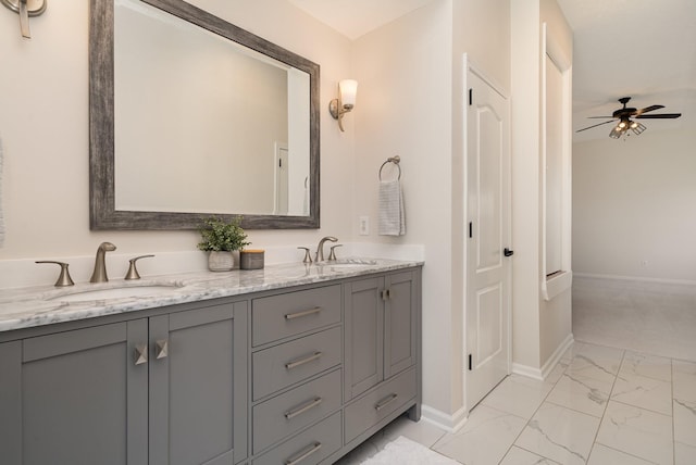 bathroom featuring ceiling fan and vanity