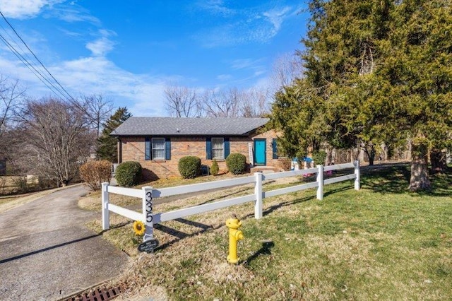 ranch-style house with a front yard