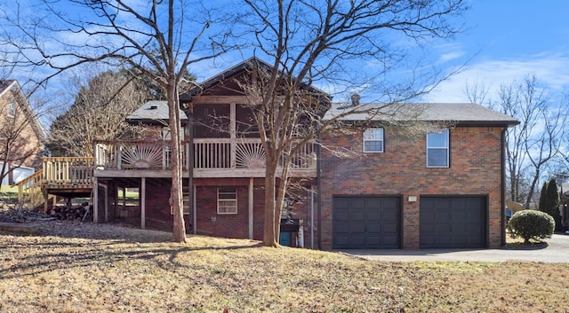 view of front facade featuring a garage and a deck