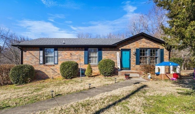 ranch-style home with a front lawn