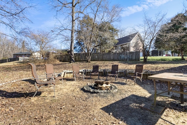 view of yard featuring a fire pit