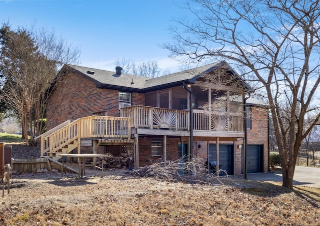 rear view of house featuring a garage