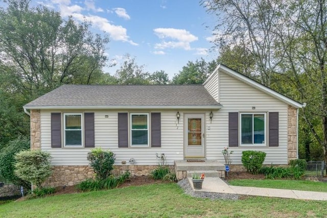 single story home featuring a front yard