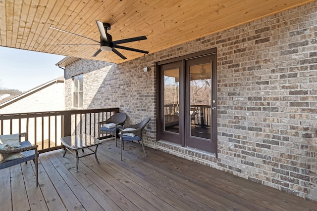 wooden deck featuring french doors and ceiling fan