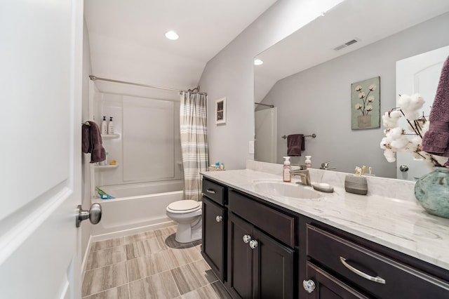 full bathroom featuring lofted ceiling, vanity, toilet, and shower / tub combo with curtain