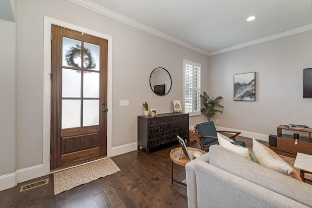 foyer entrance featuring crown molding and dark wood-type flooring