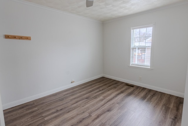 unfurnished room featuring crown molding, ceiling fan, and wood-type flooring