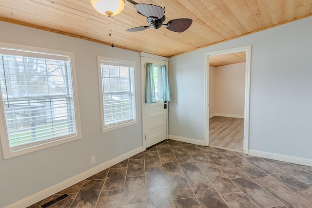 doorway featuring wooden ceiling and ceiling fan