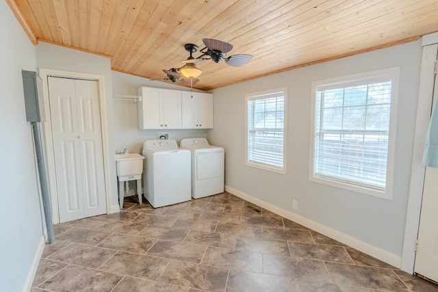 laundry room with ceiling fan, cabinets, ornamental molding, washing machine and clothes dryer, and wooden ceiling