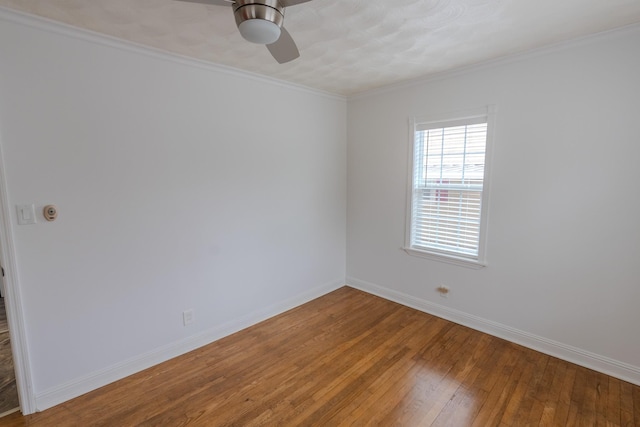 unfurnished room with crown molding, ceiling fan, and wood-type flooring