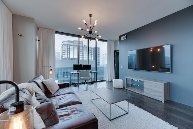 living room with dark hardwood / wood-style flooring, floor to ceiling windows, and a chandelier